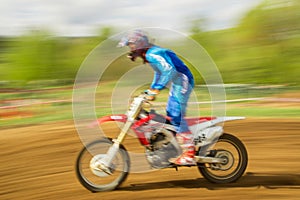 Biker on motocross in motion