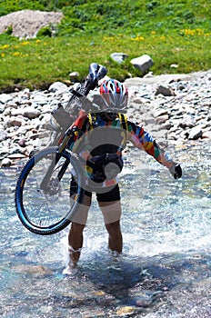 Biker and mountain river