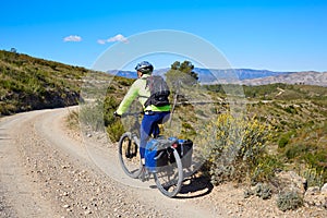 Biker MTB cycle tourism with panniers in Spain