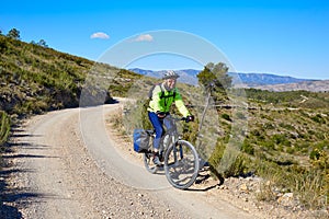 Biker MTB cycle tourism with panniers in Spain