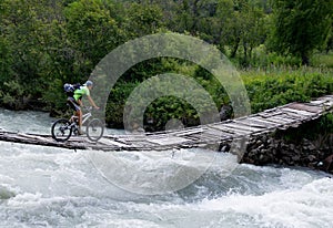 Biker on outboard bridge