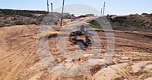 Biker person, motorcycle or turn on dirt road in speed, motorcross or balance as safety challenge. Pro rider, motorbike