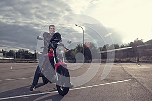 Biker posing on motorbike