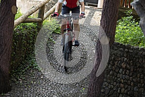 biker riding down a ramp at park