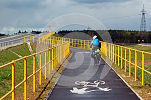 A biker riding on Green Velo bicycle route, the longest consistently marked cycle trail in Eastern Poland