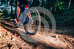 Biker riding his bike on a dirt trail through the woods, Xtreme cycling