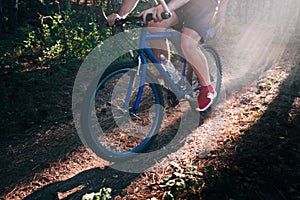 Biker riding his bike on a dirt trail through the woods, Xtreme cycling