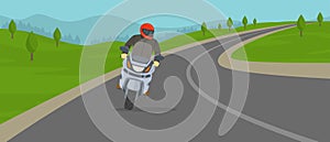 Biker riding motorcycle on the highway. Cornering or turning bike.