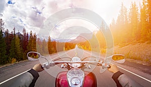 Biker Riding on a Motorcycle on a scenic Road