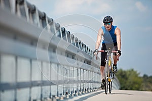 Biker riding on race road bike