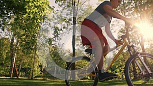 Biker stunt performer effectively performs stunts on a bicycle.