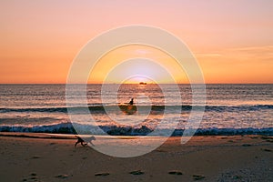 Biker on sunrise beach beautiful view