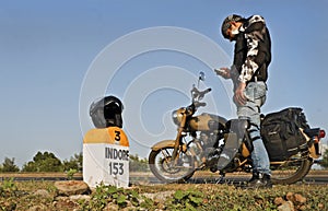 Biker texting sms using mobile phone