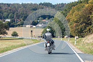 Biker on a winding country road