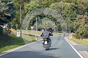 Biker on a winding country road
