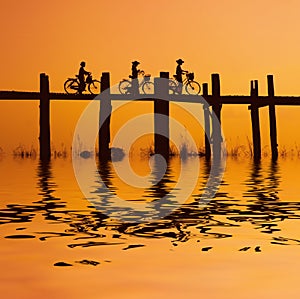 Bikers on bridge 2 photo