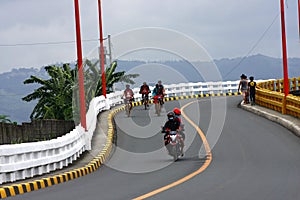 Bikers and motorcycle riders cross the Tumana Bridge in Marikina City.