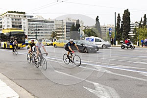 Bikers pedaling on the streets of Athens city photo