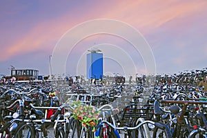 Bikes in Amsterdam harbor in the Netherlands at sunset