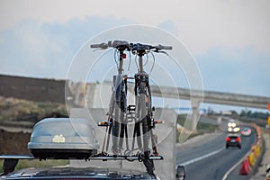 bikes attached to the roof of the car. Travelling with bikes by car