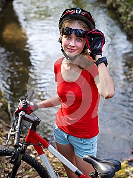 Bikes bicycling girl cycling fording throught water .