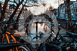 Bikes on a Bridge in Amsterdam, Netherlands Wet Overcast Weather Vacation Destination Transportation