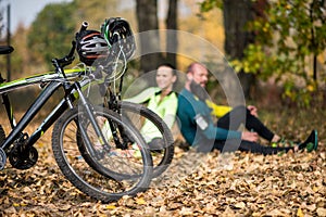 Bikes and couple of cyclists in park