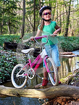 Bikes cycling girl cycling fording throught water .