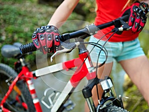 Bikes cycling girl cycling fording throught water .