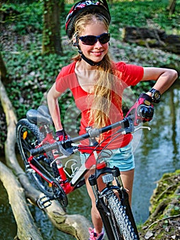 Bikes cycling girl cycling fording throught water .