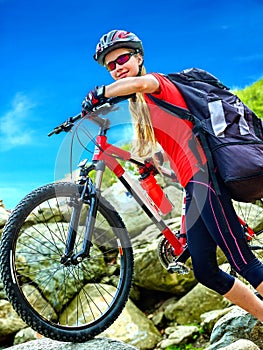 Bikes cycling girl into park.