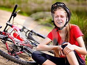 Bikes cycling girl wearing helmet. Girl girl fell off bike.