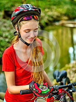 Bikes cycling girl wearing helmet look at compass.