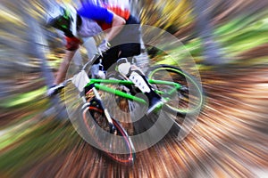 Biking as extreme and fun sport. Downhill biking. Biker jumps.