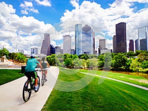 Biking in City Park with Houston Skyline in Distance