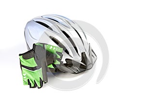 A biking helmet with gloves on a white background