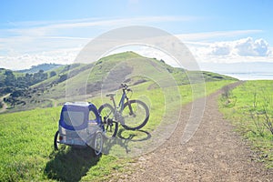 Biking in the hills with child trailer