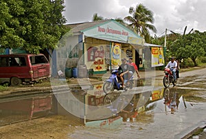 Biking on rain soaked road in the tropics