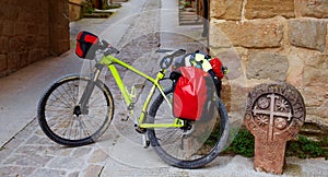 Biking Way of Saint James stone sign in Cirauqui photo