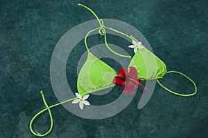 Bikini floating with pumleria and hibiscus flowers