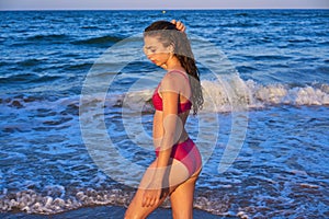 Bikini girl in the beach blue shore photo