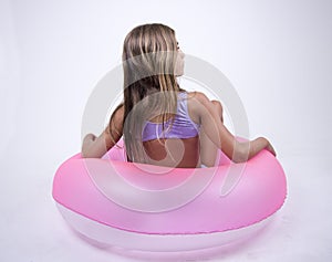 Bikini girl on a float on her back