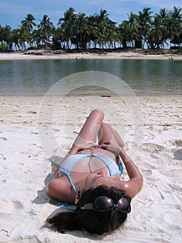 Bikini lady beach suntanning