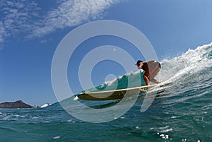 A bikini longboard surfer