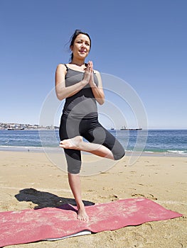 Bikram yoga tadasana pose at beach