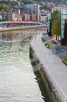 Bilbao scenic cityscape. Bridge over river Nervion in Bilbao. Bilbao landmark, capital of Basque Country, Spain. Colorful autumn.