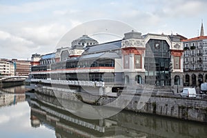 Exterior view at the NerviÃÂ³n river and Areatzako zubia bridge, Ribera Market, Bilbao downtown city, Spain photo