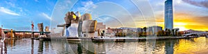 Bilbao, Spain - NOV 20, 2021: awesome evening panoramic view of The Guggenheim Museum designed by Frank Gehry and embankment