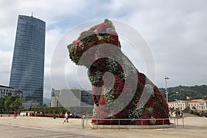Bilbao, Spain- September 2018: A flower puppy statue in front of Guggenheim Museum in Bilbao, Spain