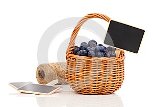 Bilberry in a basket to the board for text